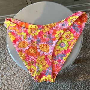 This is Kulani Kinis both the top and bottom are smalls. Bright pink and orange.